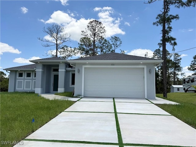 1009 Euclid Ave, Lehigh Acres, FL 33972 - view of front facade with stucco siding, driveway, an attached garage, and a front yard