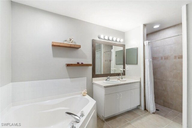 2833 NW 4th Ave, Cape Coral, FL 33993 - bathroom with a bath, vanity, a tile shower, and tile patterned floors