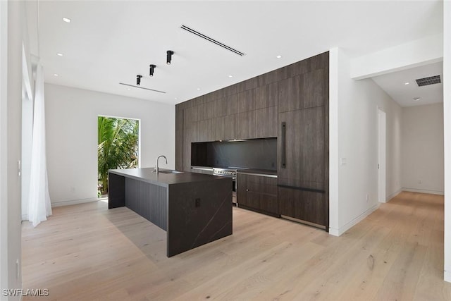 1135 Bluebird Ave, Marco Island, FL 34145 - home office featuring light wood-style flooring, baseboards, a sink, and recessed lighting