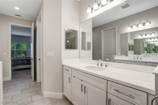 7028 Mistral Way, Fort Myers, FL 33966 - bathroom with ensuite bathroom, vanity, and baseboards