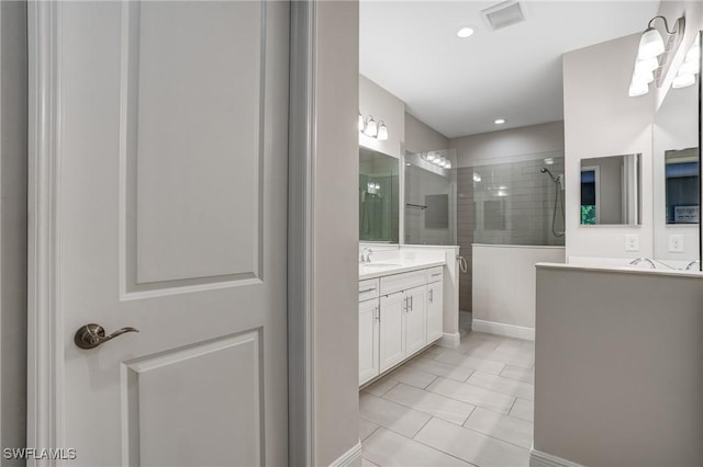 7028 Mistral Way, Fort Myers, FL 33966 - bathroom with a walk in shower, vanity, tile patterned floors, baseboards, and recessed lighting