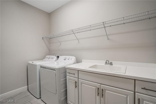 7028 Mistral Way, Fort Myers, FL 33966 - washroom featuring cabinet space, independent washer and dryer, and baseboards
