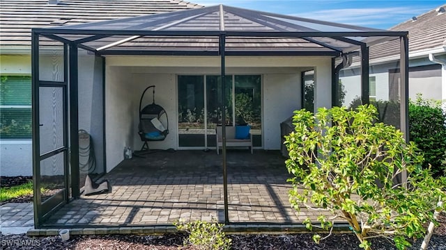 7028 Mistral Way, Fort Myers, FL 33966 - entrance to property featuring stucco siding and a patio area
