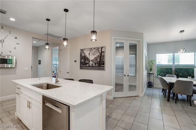 7028 Mistral Way, Fort Myers, FL 33966 - kitchen with stainless steel dishwasher, a sink, french doors, hanging light fixtures, and recessed lighting