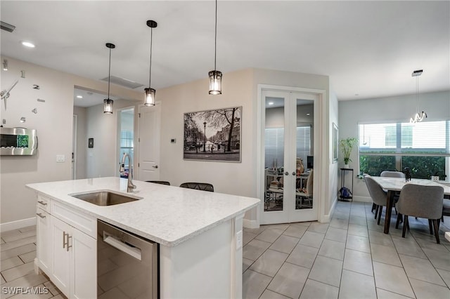 7028 Mistral Way, Fort Myers, FL 33966 - kitchen featuring stainless steel dishwasher, a sink, french doors, hanging light fixtures, and recessed lighting