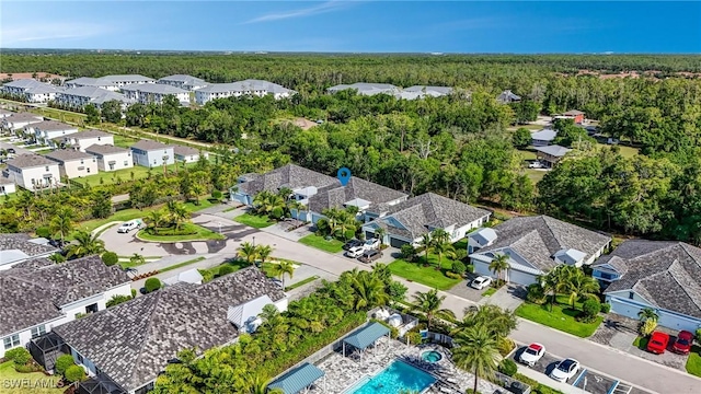 7028 Mistral Way, Fort Myers, FL 33966 - aerial view of residential area with a forest and a pool