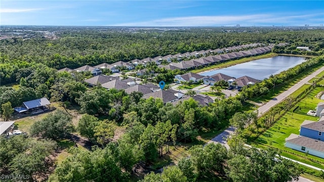 7028 Mistral Way, Fort Myers, FL 33966 - aerial view of residential area featuring a forest and a nearby body of water