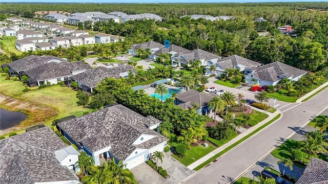 7028 Mistral Way, Fort Myers, FL 33966 - aerial perspective of suburban area with a forest
