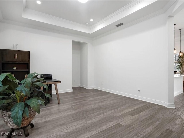 836 14th St SE, Naples, FL 34117 - spare room with dark wood finished floors, a raised ceiling, baseboards, crown molding, and recessed lighting