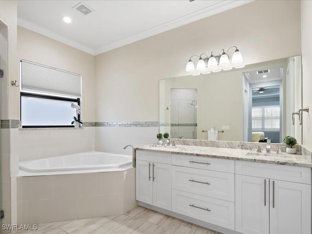 836 14th St SE, Naples, FL 34117 - full bathroom with double vanity, a shower stall, a garden tub, ornamental molding, and ensuite bath
