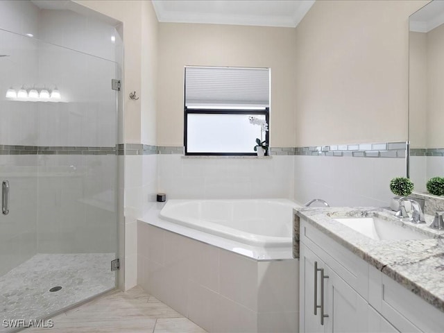 836 14th St SE, Naples, FL 34117 - bathroom featuring vanity, a garden tub, a shower stall, and ornamental molding