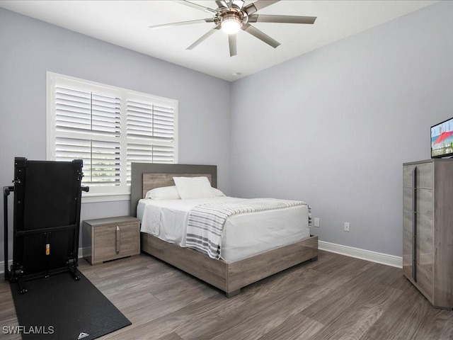 836 14th St SE, Naples, FL 34117 - bedroom featuring wood finished floors, baseboards, and ceiling fan