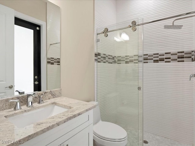 836 14th St SE, Naples, FL 34117 - full bathroom with a stall shower, toilet, and vanity