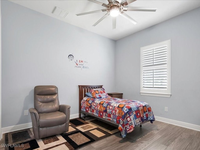 836 14th St SE, Naples, FL 34117 - bedroom featuring wood finished floors, baseboards, and a ceiling fan
