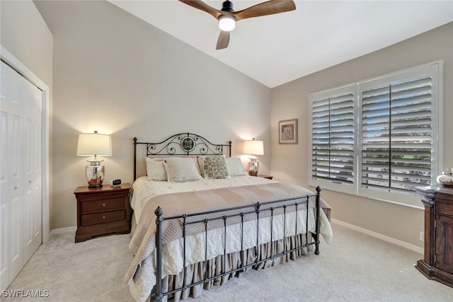 8560 Danbury Blvd Unit 202, Naples, FL 34120 - bedroom featuring carpet flooring, a closet, vaulted ceiling, baseboards, and ceiling fan
