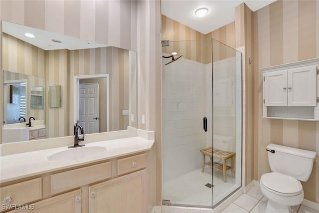 8560 Danbury Blvd Unit 202, Naples, FL 34120 - bathroom with a stall shower, wallpapered walls, toilet, tile patterned floors, and vanity