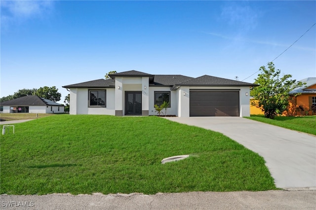 3201 14th St W, Lehigh Acres, FL 33971 - prairie-style house featuring stucco siding, driveway, a garage, and a front lawn