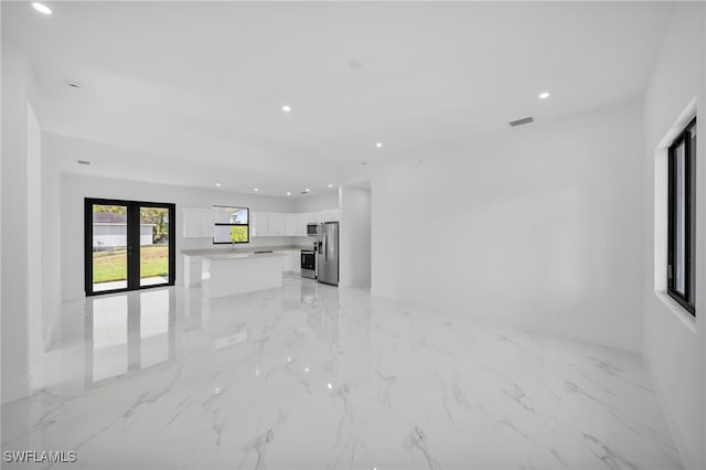 3201 14th St W, Lehigh Acres, FL 33971 - unfurnished living room featuring recessed lighting and light marble finish flooring