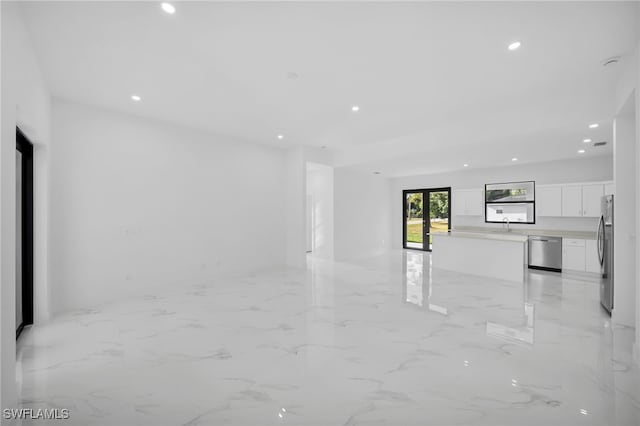 3201 14th St W, Lehigh Acres, FL 33971 - unfurnished living room featuring recessed lighting and light marble finish floors