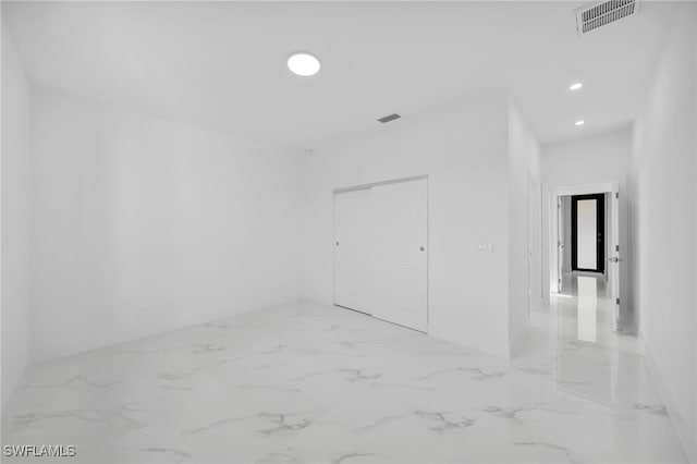 3201 14th St W, Lehigh Acres, FL 33971 - unfurnished room featuring recessed lighting and light marble finish flooring