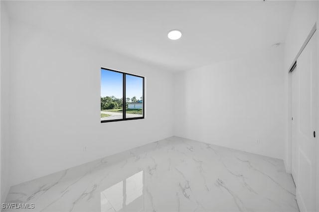3201 14th St W, Lehigh Acres, FL 33971 - spare room featuring marble finish flooring