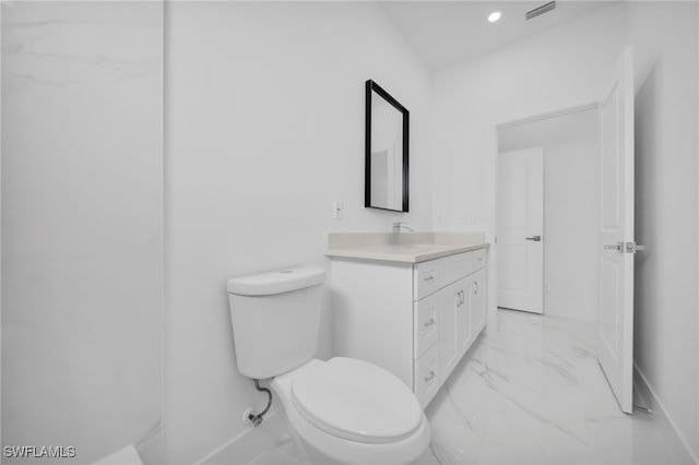 3201 14th St W, Lehigh Acres, FL 33971 - bathroom featuring marble finish flooring, toilet, baseboards, vanity, and recessed lighting