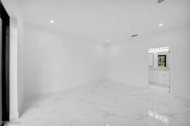 3201 14th St W, Lehigh Acres, FL 33971 - spare room with light marble finish floors and recessed lighting