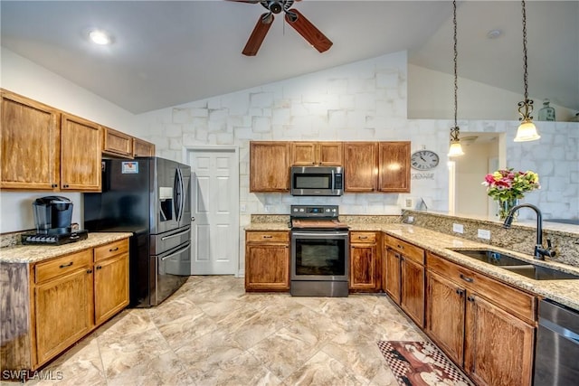 1812 SW 10th Ter, Cape Coral, FL 33991 - kitchen featuring appliances with stainless steel finishes, a sink, a ceiling fan, brown cabinetry, and high vaulted ceiling