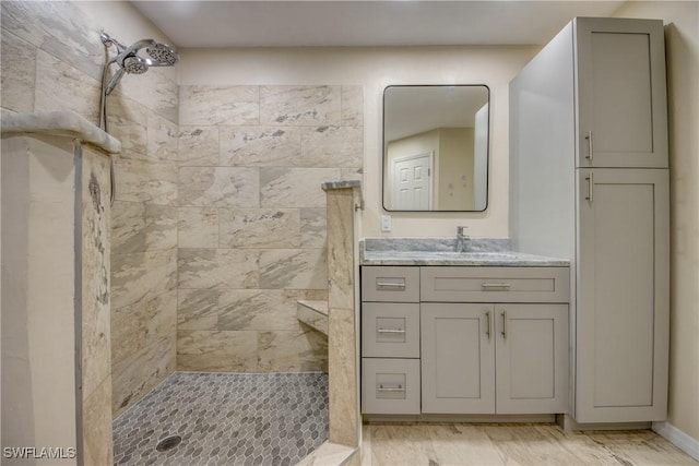 1812 SW 10th Ter, Cape Coral, FL 33991 - full bath featuring a tile shower, vanity, and marble finish floors