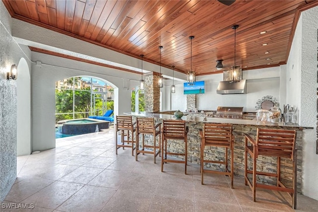 175 Topanga Dr, Bonita Springs, FL 34134 - kitchen with under cabinet range hood, a textured wall, wood ceiling, arched walkways, and crown molding