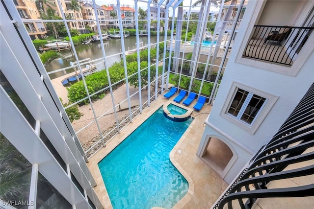 175 Topanga Dr, Bonita Springs, FL 34134 - view of swimming pool featuring a water view, a pool with connected hot tub, and a patio area