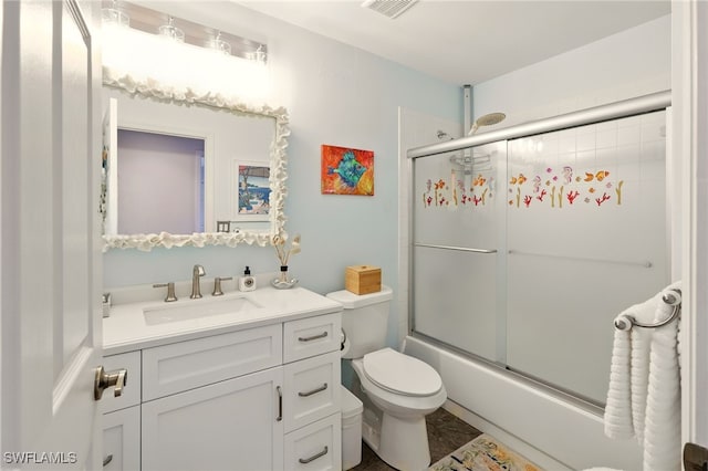 24712 Lakemont Cove Ln Unit 202, Bonita Springs, FL 34134 - full bathroom featuring vanity, toilet, and enclosed tub / shower combo
