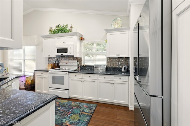 24712 Lakemont Cove Ln Unit 202, Bonita Springs, FL 34134 - kitchen featuring white appliances, ornamental molding, white cabinetry, decorative backsplash, and dark wood finished floors