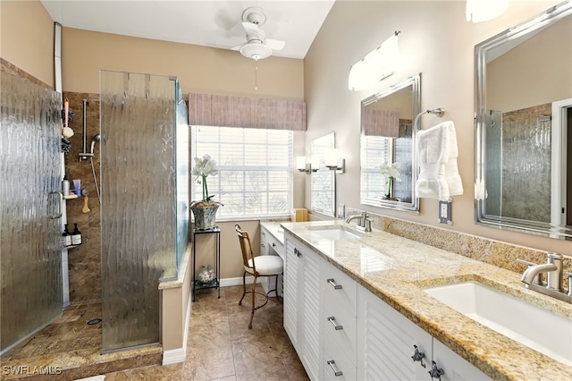 24712 Lakemont Cove Ln Unit 202, Bonita Springs, FL 34134 - full bathroom featuring a ceiling fan, a walk in shower, and double vanity