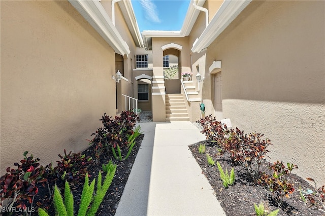 24712 Lakemont Cove Ln Unit 202, Bonita Springs, FL 34134 - property entrance with stucco siding