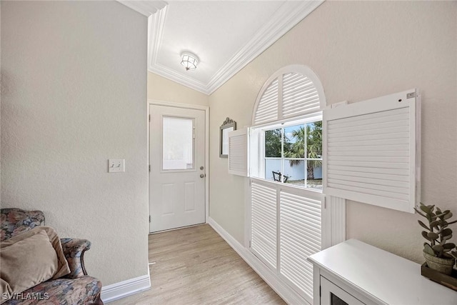180 20th St SE, Naples, FL 34117 - entryway with ornamental molding, baseboards, and light wood-style flooring