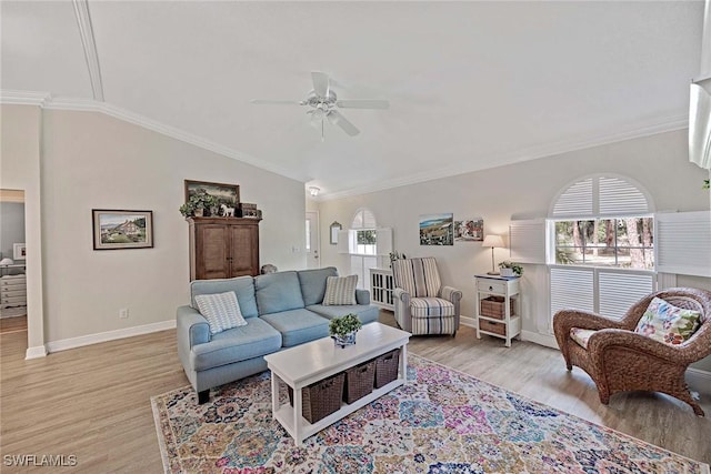 180 20th St SE, Naples, FL 34117 - living area with a ceiling fan, light wood-style flooring, baseboards, crown molding, and lofted ceiling