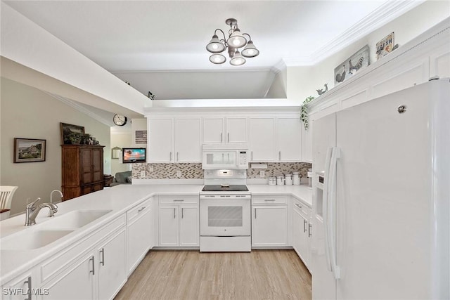 180 20th St SE, Naples, FL 34117 - kitchen featuring white appliances, a sink, backsplash, white cabinetry, and ornamental molding
