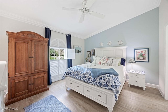 180 20th St SE, Naples, FL 34117 - bedroom with vaulted ceiling, crown molding, light wood finished floors, ceiling fan, and baseboards