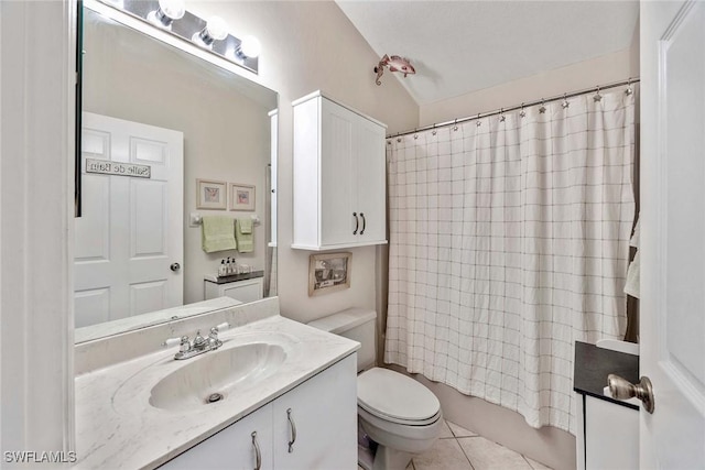 180 20th St SE, Naples, FL 34117 - full bath with vanity, toilet, tile patterned floors, shower / tub combo with curtain, and lofted ceiling