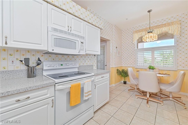 14121 Brant Point Cir Unit 1403, Fort Myers, FL 33919 - kitchen featuring white appliances, wallpapered walls, white cabinets, decorative light fixtures, and light tile patterned flooring