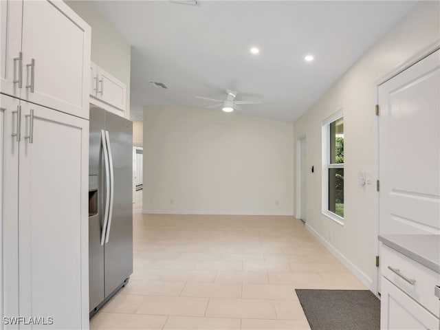 145 33rd Ave NE, Naples, FL 34120 - kitchen featuring stainless steel fridge with ice dispenser, a ceiling fan, recessed lighting, white cabinetry, and baseboards