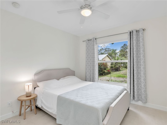 145 33rd Ave NE, Naples, FL 34120 - bedroom with baseboards and a ceiling fan