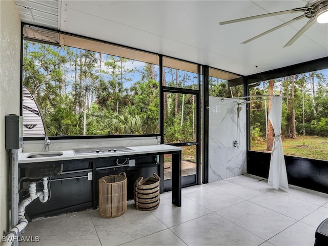 145 33rd Ave NE, Naples, FL 34120 - unfurnished sunroom with a ceiling fan and plenty of natural light