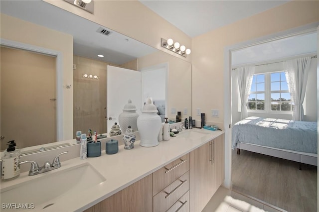 15901 Royal Pointe Ln Unit 301, Fort Myers, FL 33908 - bathroom with double vanity, ensuite bathroom, and a tile shower