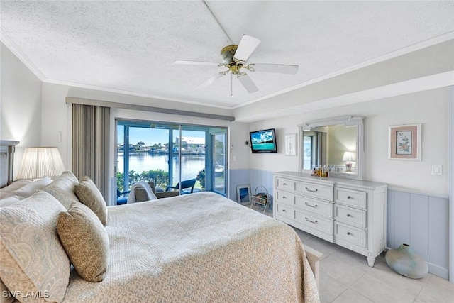 1829 SE 41st St Unit 1I, Cape Coral, FL 33904 - bedroom featuring ornamental molding, wainscoting, access to exterior, light tile patterned flooring, and ceiling fan