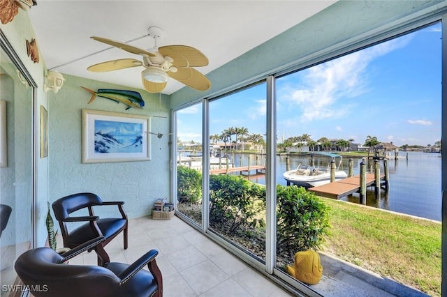 1829 SE 41st St Unit 1I, Cape Coral, FL 33904 - sunroom / solarium with a water view, a textured wall, ceiling fan, and tile patterned floors