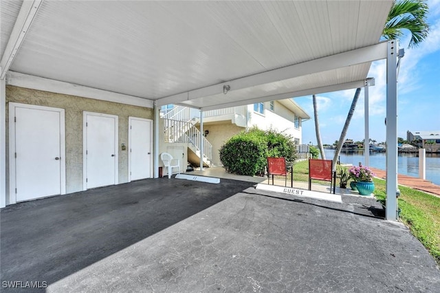 1829 SE 41st St Unit 1I, Cape Coral, FL 33904 - view of patio / terrace with stairway and a water view