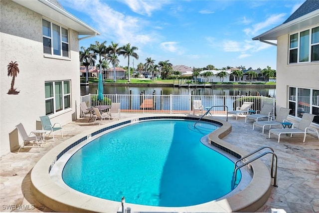 1829 SE 41st St Unit 1I, Cape Coral, FL 33904 - community pool featuring a fenced backyard, a water view, a patio area, and a residential view