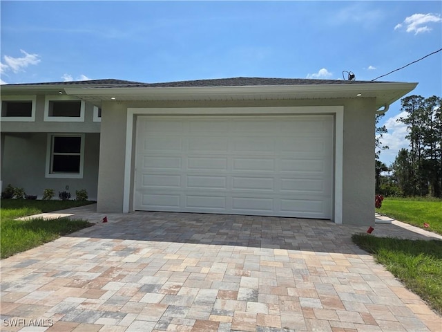 222 Victoria Ave S, Lehigh Acres, FL 33974 - garage with decorative driveway